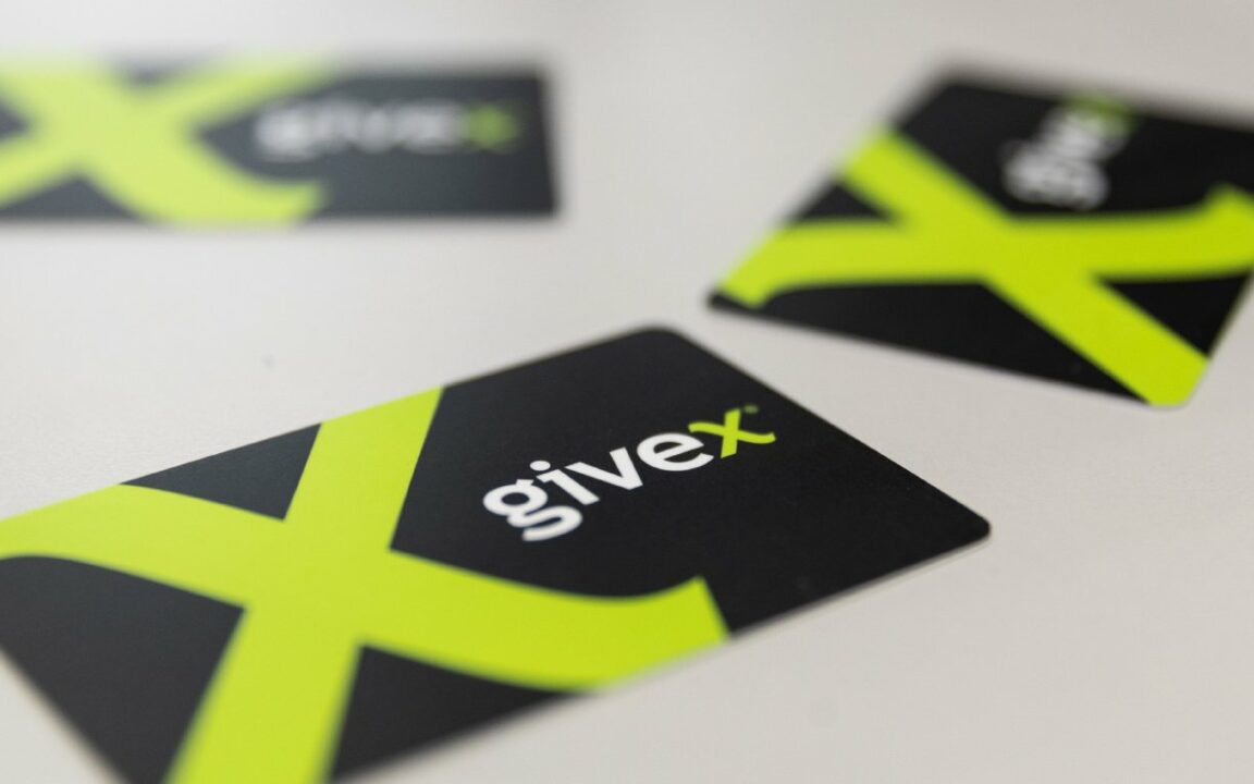 Three Givex gift cards on a table